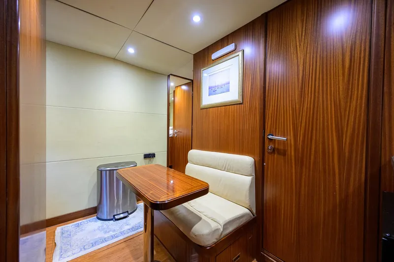 Slide: The Image of Luxurious interior of 2013 Ocean Alexander Sky Lounge with wood paneling and cozy seating. - 89