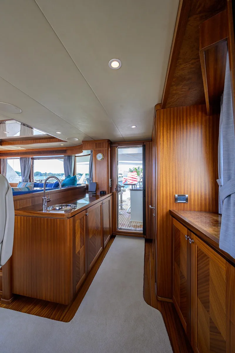 Slide: The Image of Luxurious 2013 Ocean Alexander Sky Lounge interior with elegant wood finishes and modern amenities. - 92