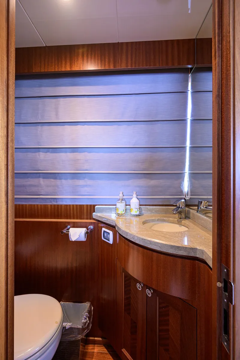 Slide: The Image of Luxurious bathroom in 2013 Ocean Alexander Sky Lounge yacht with wood accents and modern fixtures. - 95