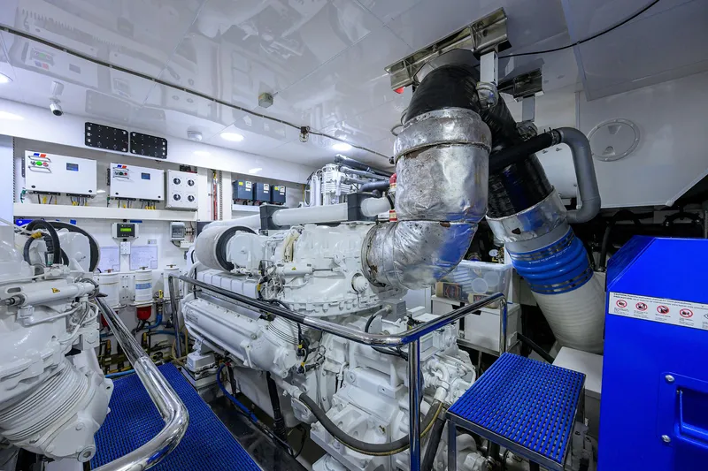 Slide: The Image of Engine room of 2013 Ocean Alexander Sky Lounge yacht, featuring advanced machinery and control panels. - 103