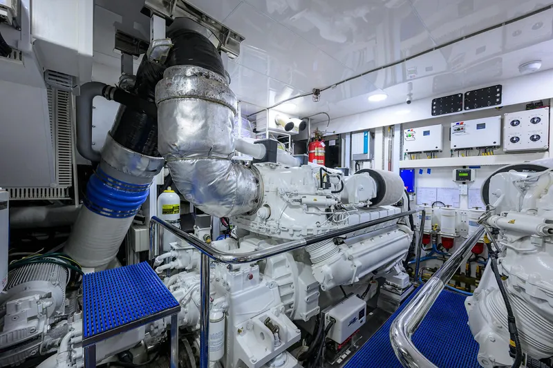 Slide: The Image of Engine room of 2013 Ocean Alexander Sky Lounge yacht, featuring advanced machinery and control panels. - 106
