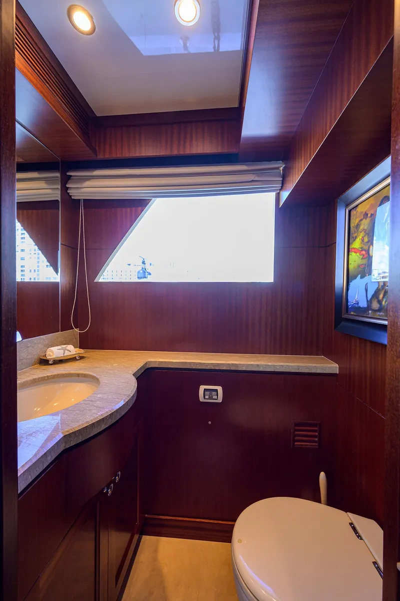 Slide: The Image of Luxurious bathroom in 2013 Ocean Alexander Sky Lounge yacht with modern fixtures and wood accents. - 14