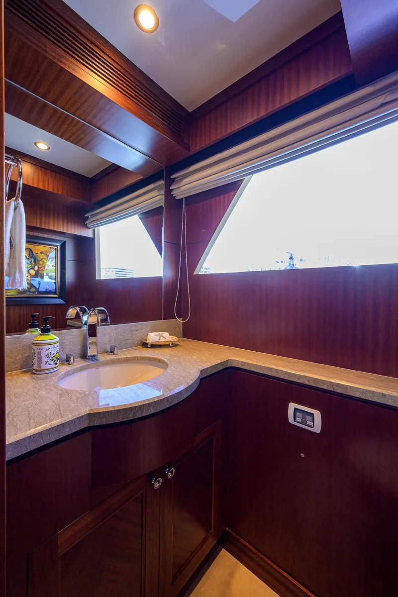Slide: The Image of Luxurious bathroom interior of 2013 Ocean Alexander Sky Lounge yacht with wood accents and modern fixtures. - 18