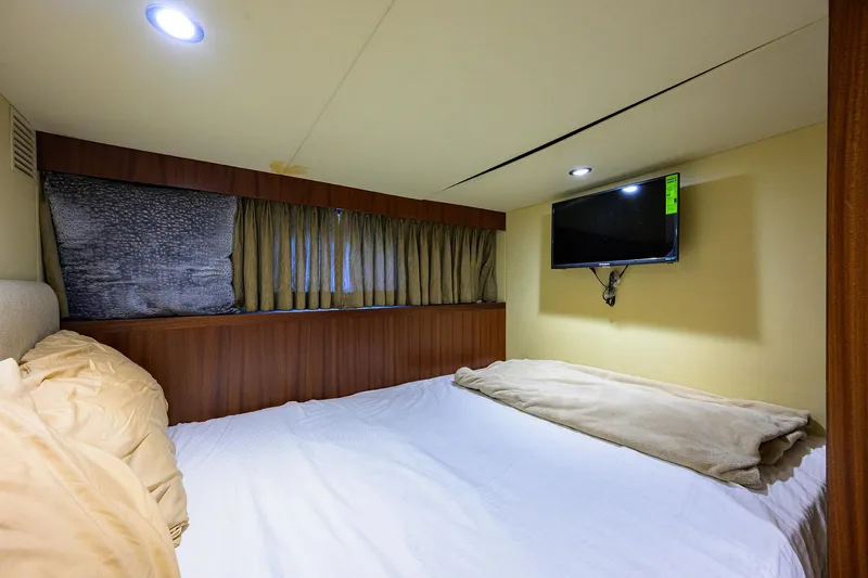 Slide: The Image of Cozy bedroom in 2013 Ocean Alexander Sky Lounge yacht with TV and window. - 30