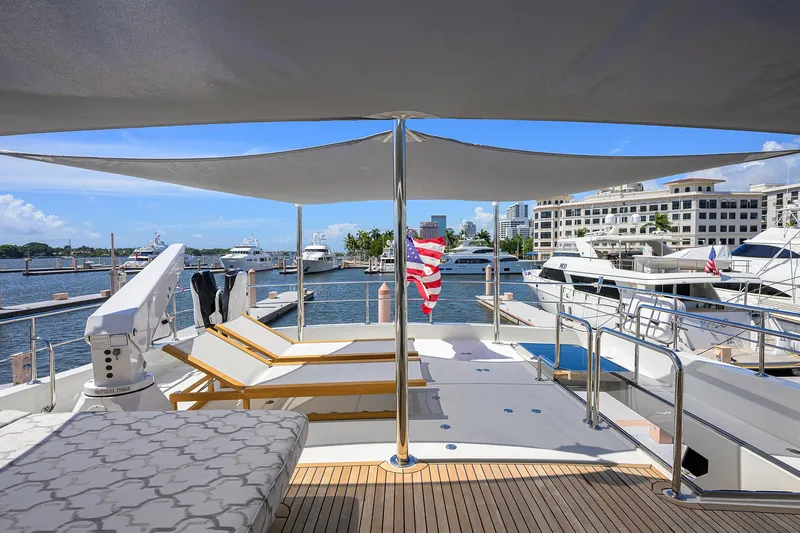 Slide: The Image of Luxurious 2013 Ocean Alexander Sky Lounge yacht docked at a marina with sun loungers. - 32