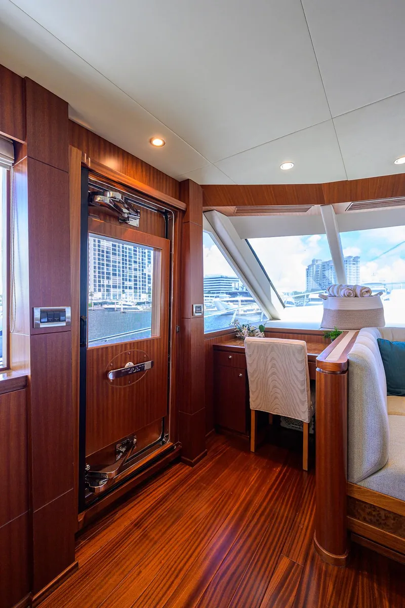 Slide: The Image of Luxurious interior of 2013 Ocean Alexander Sky Lounge yacht with elegant wood finishes and waterfront view. - 33