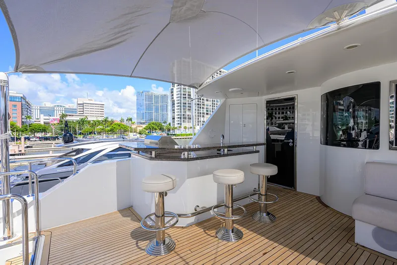 Slide: The Image of Luxurious 2013 Ocean Alexander Sky Lounge yacht with sleek bar and cityscape view. - 43