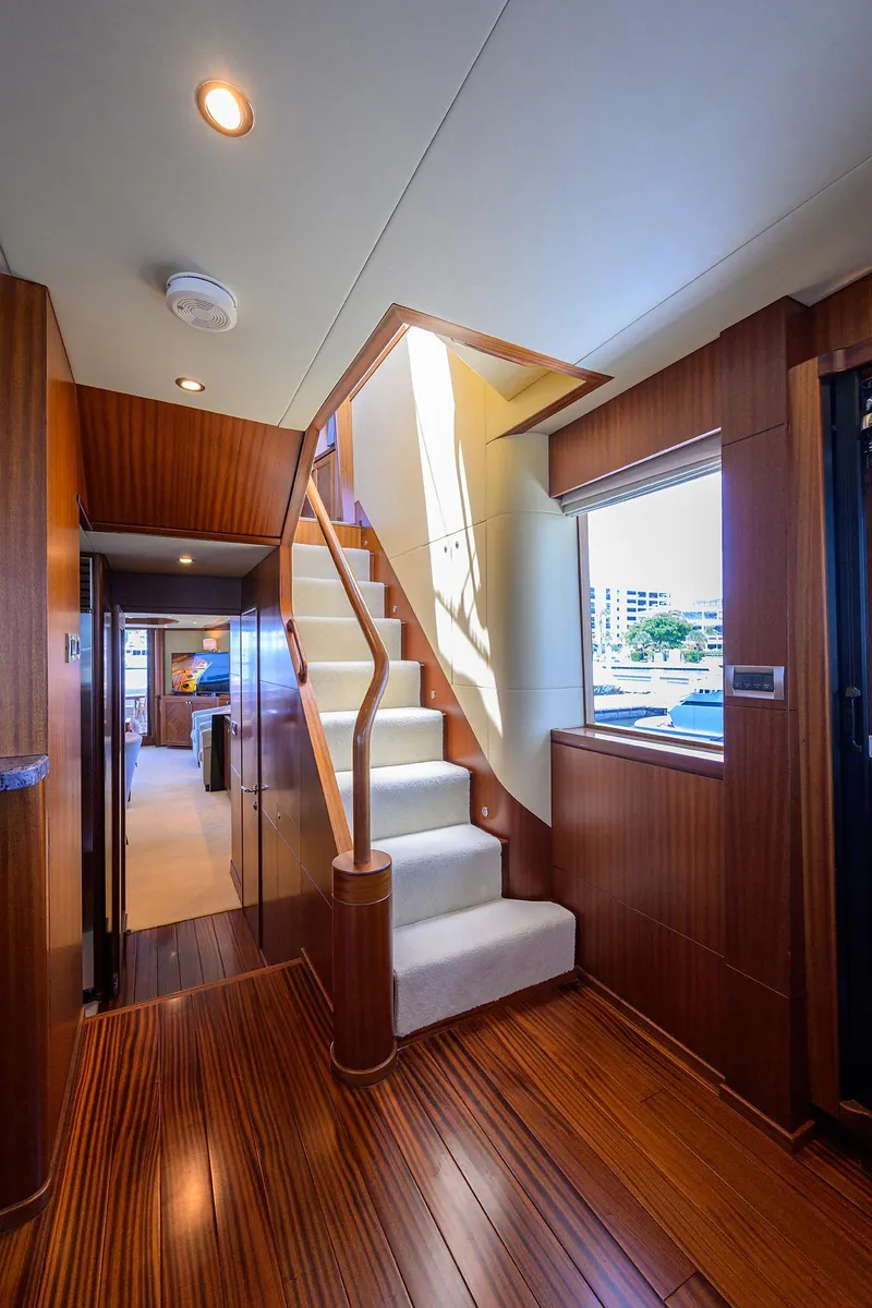 Slide: The Image of Luxurious interior of 2013 Ocean Alexander Sky Lounge yacht with elegant wooden staircase. - 44
