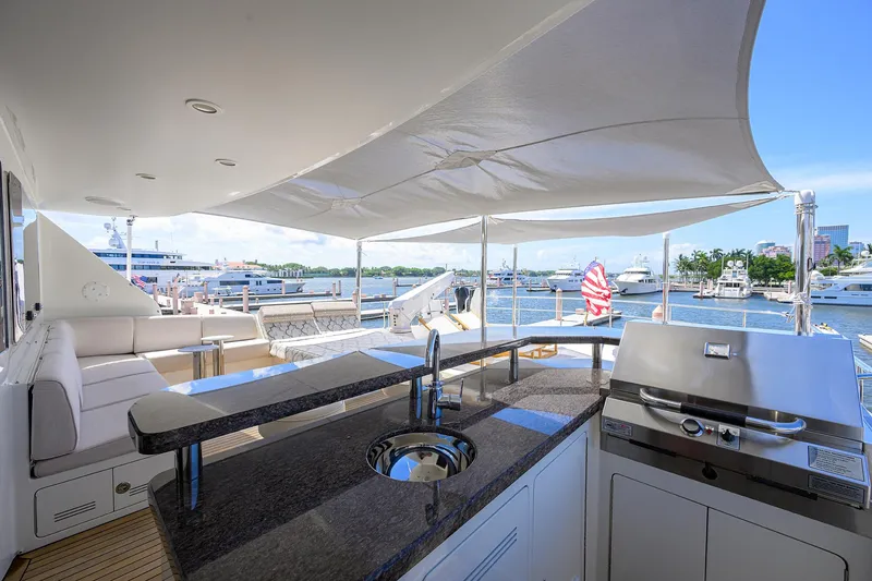 Slide: The Image of Luxurious 2013 Ocean Alexander Sky Lounge yacht with outdoor seating and grill, docked at marina. - 52