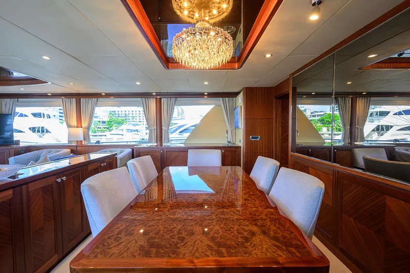 Slide: The Image of Luxurious dining area on 2013 Ocean Alexander Sky Lounge yacht with elegant chandelier. - 58
