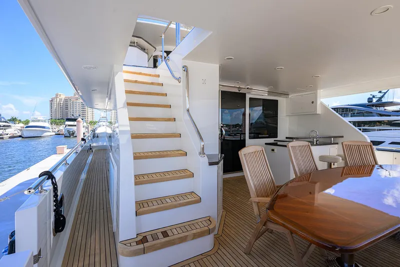 Slide: The Image of Luxurious 2013 Ocean Alexander Sky Lounge yacht deck with elegant seating and staircase. - 6
