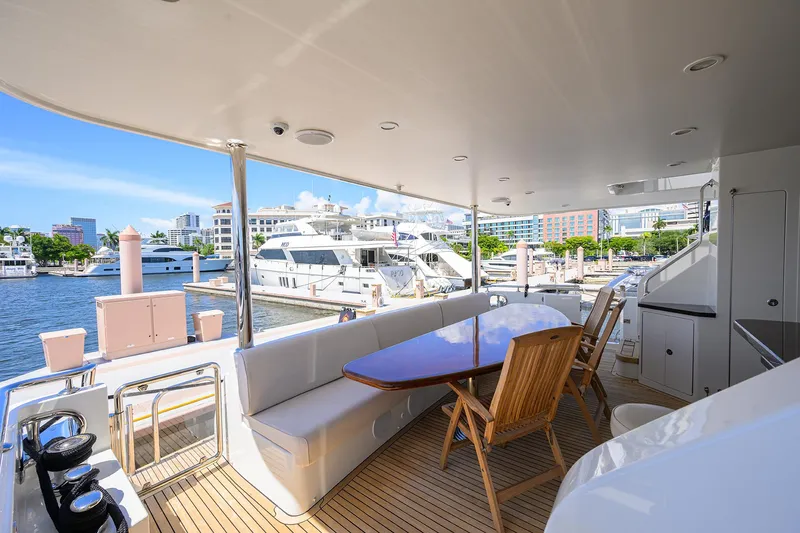 Slide: The Image of Luxurious 2013 Ocean Alexander Sky Lounge yacht with elegant outdoor seating and marina view. - 7