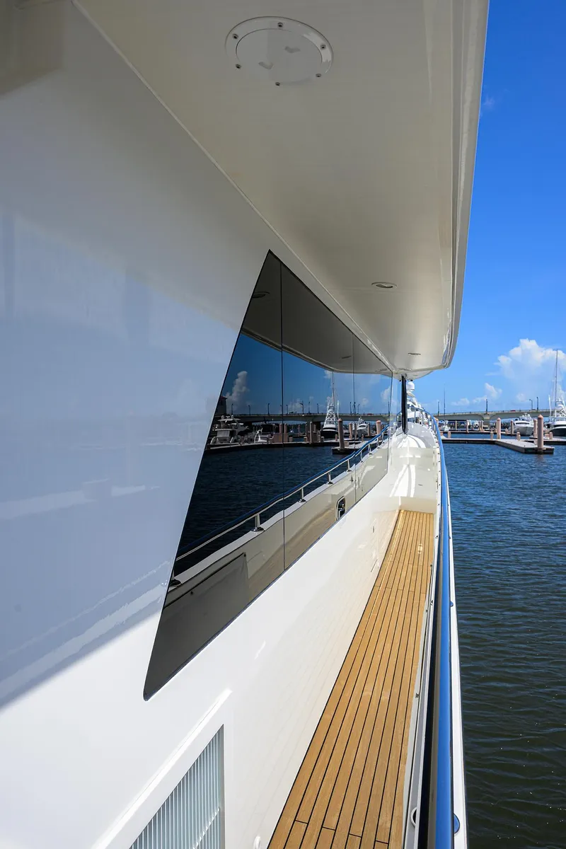 Slide: The Image of 2013 Ocean Alexander Sky Lounge yacht with sleek design and wooden deck, docked at marina. - 72