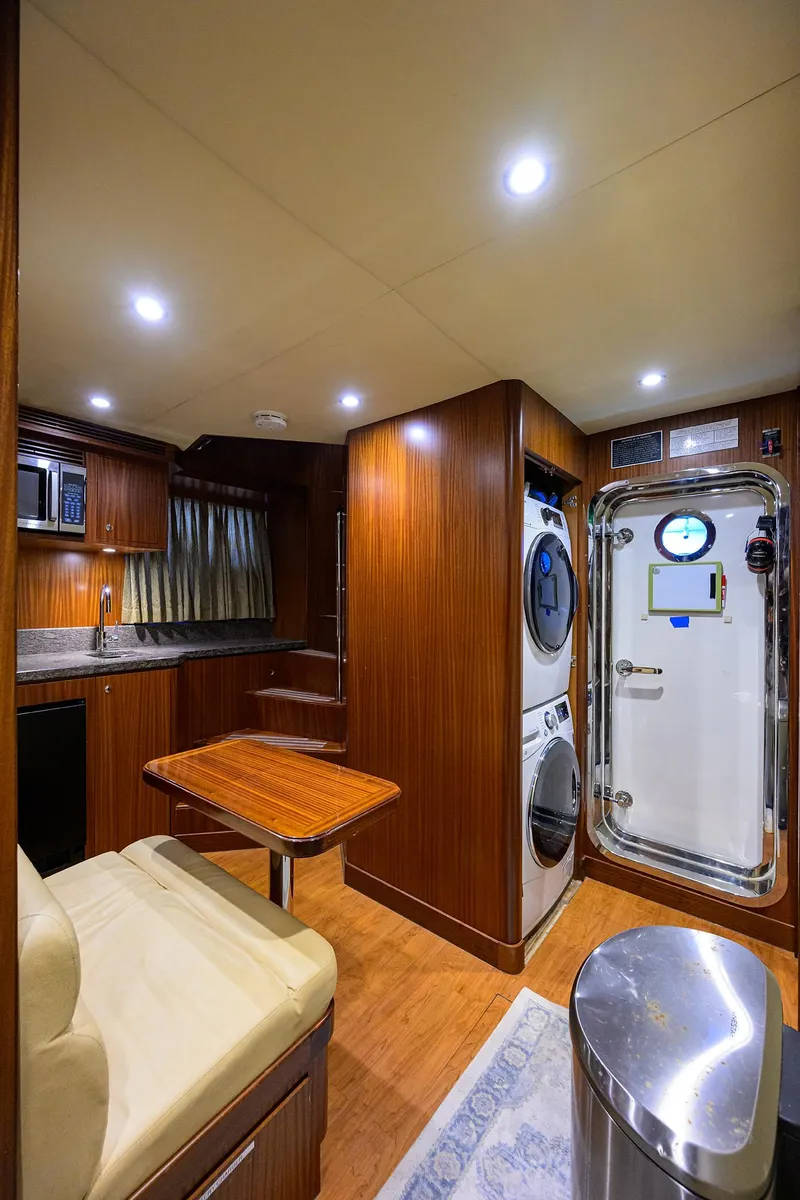 Slide: The Image of Luxurious 2013 Ocean Alexander Sky Lounge interior with kitchen, seating, and laundry area. - 76