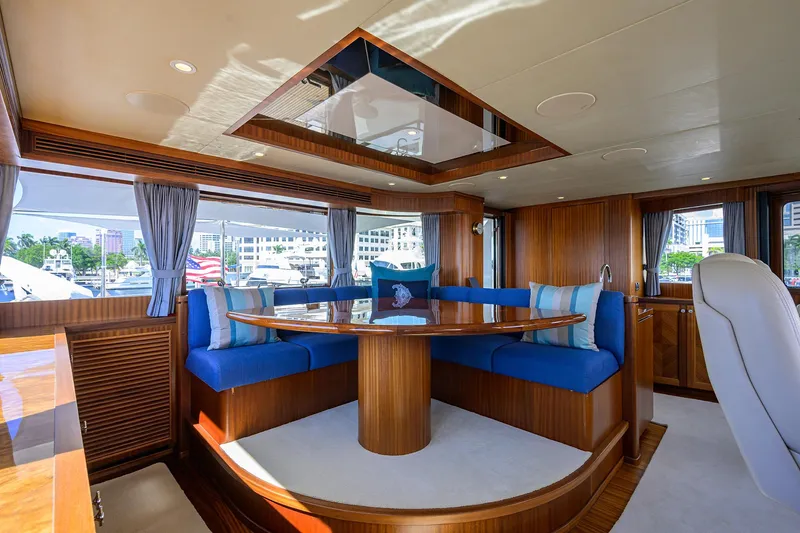 Slide: The Image of Luxurious 2013 Ocean Alexander Sky Lounge interior with elegant wood and blue seating. - 83