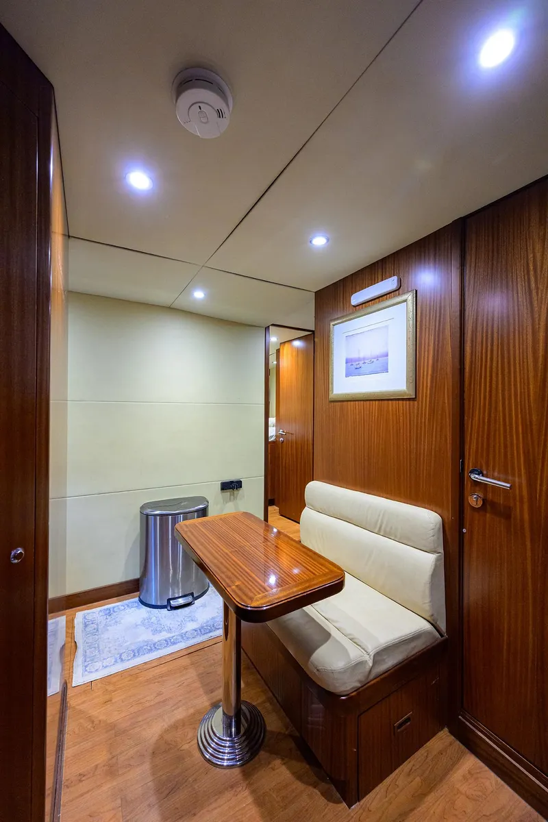 Slide: The Image of Luxurious 2013 Ocean Alexander Sky Lounge interior with wood paneling and cozy seating area. - 88