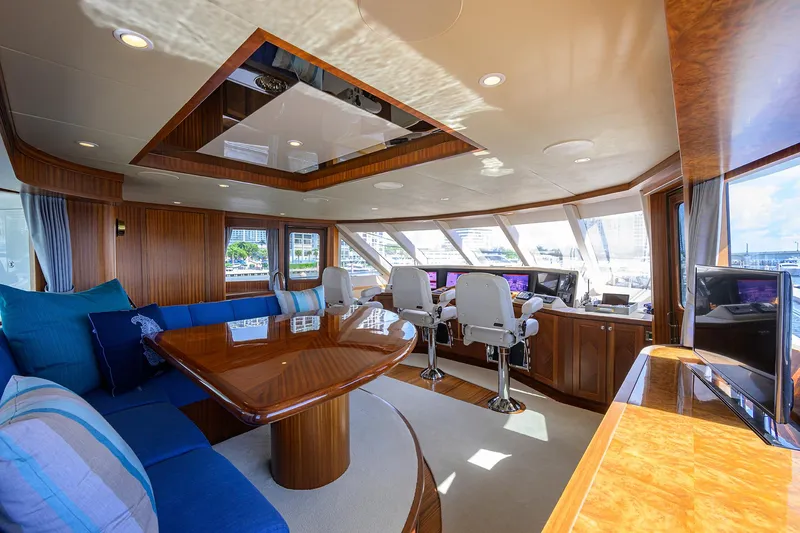 Slide: The Image of Luxurious interior of 2013 Ocean Alexander Sky Lounge yacht with plush seating and panoramic windows. - 90