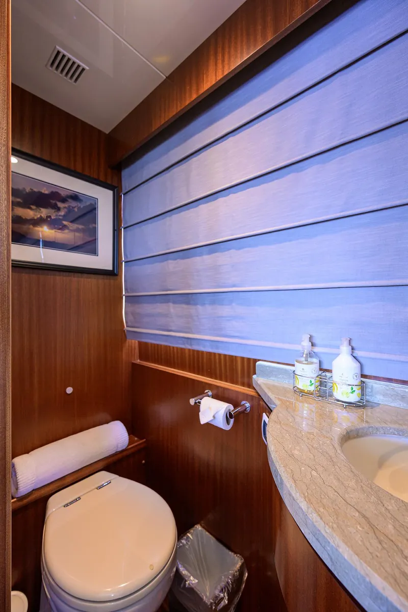 Slide: The Image of Luxurious bathroom in 2013 Ocean Alexander Sky Lounge yacht with elegant wood paneling. - 97