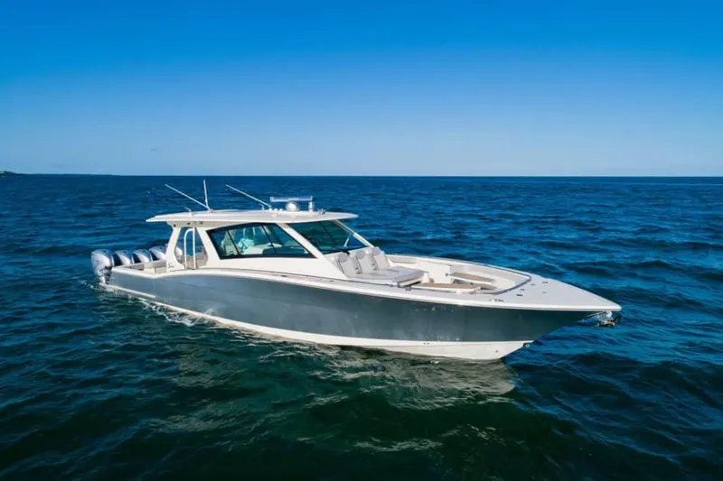 The Image of 2024 Scout 530 LXF luxury boat cruising on open water. - 0