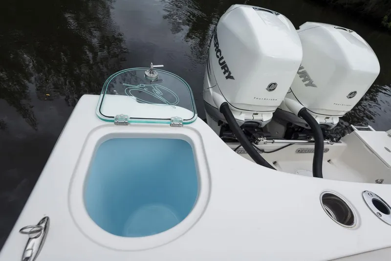 Slide: The Image of 2024 Sailfish 320 CC boat with dual Mercury engines and livewell. - 17
