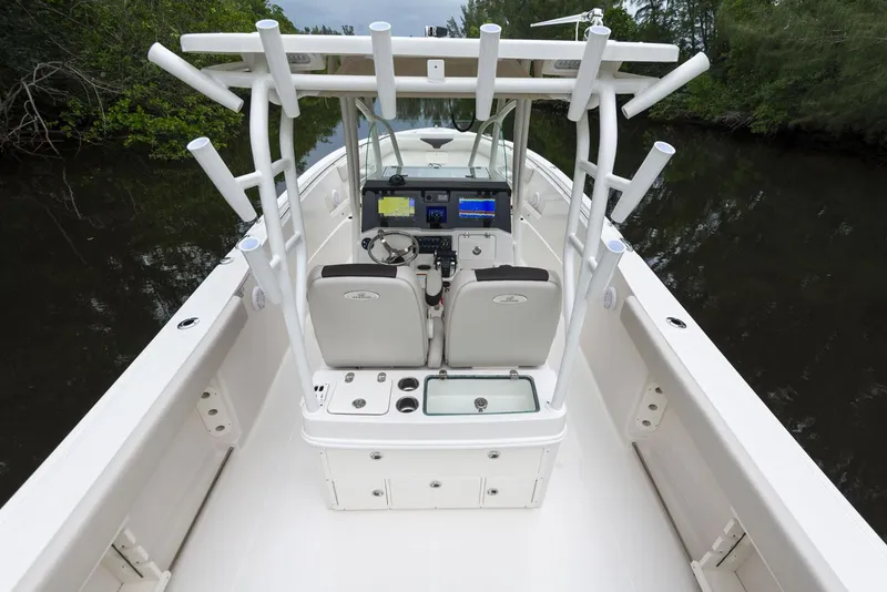 Slide: The Image of 2024 Sailfish 320 CC center console boat with advanced navigation system. - 2
