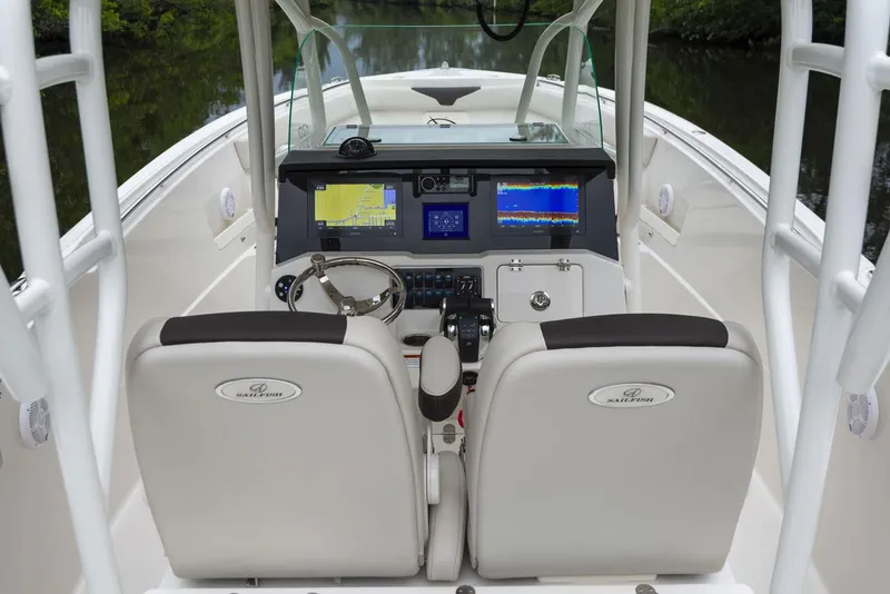 Slide: The Image of 2024 Sailfish 320 CC boat cockpit with dual seats and advanced navigation system. - 8