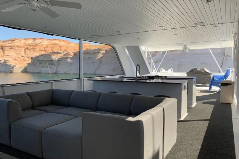 Slide: The Image of Luxurious Adonia Harmony Share 2 houseboat interior with modern seating and scenic lake view, 2020 model. - 23
