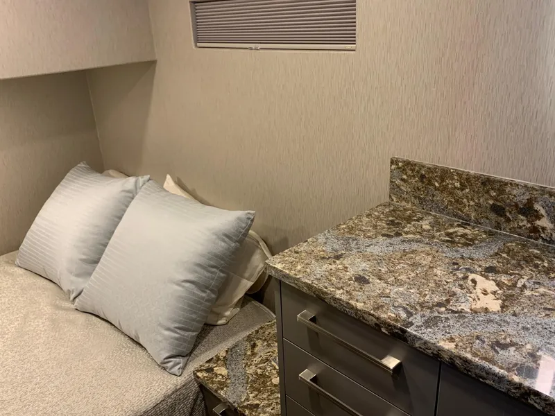 Slide: The Image of Compact bedroom in Adonia Harmony Share 2, 2020 model, featuring granite countertop and cozy bedding. - 6