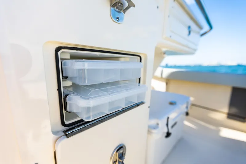 Slide: The Image of Scout 260 LXF 2026 boat with storage and ocean view. - 13