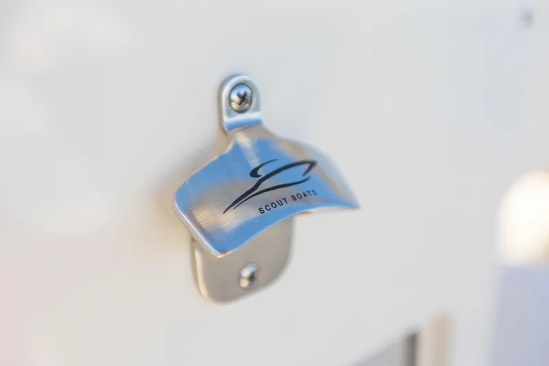 Slide: The Image of Scout 260 LXF 2026 bottle opener on boat. - 14