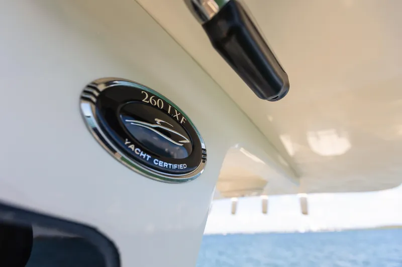 Slide: The Image of Scout 260 LXF 2026, yacht certified emblem on boat. - 17