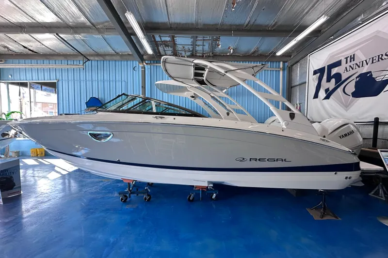 The Image of 2026 Regal LX6 boat displayed indoors, showcasing sleek design and modern features. - 0