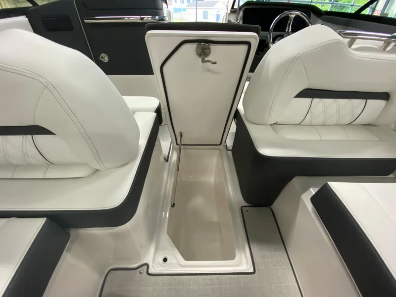 Slide: The Image of 2026 Regal LX6 boat interior with luxurious white seating and modern design. - 11