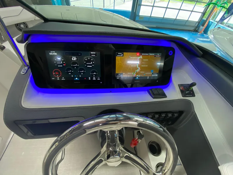 Slide: The Image of Luxurious interior of 2026 Regal LX6 boat with white leather seating and cup holders. - 12