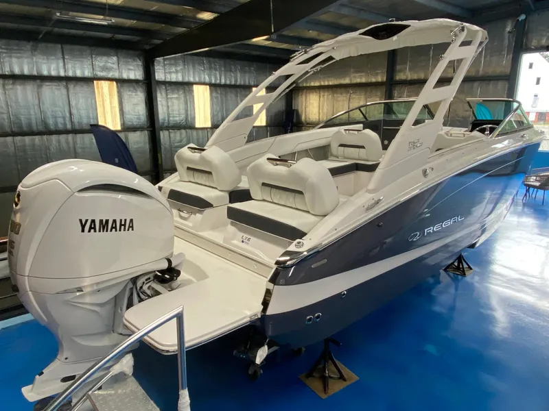 Slide: The Image of 2026 Regal LX6 boat displayed indoors, celebrating 75th anniversary. - 2