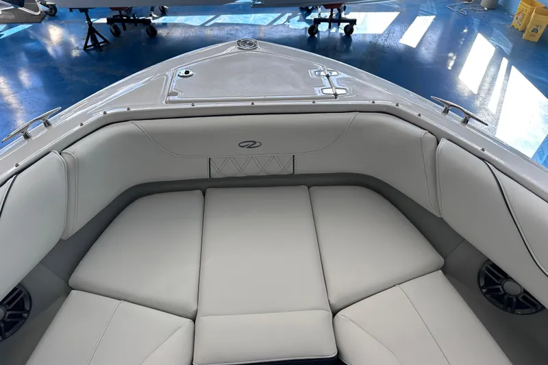 Slide: The Image of 2026 Regal LX6 boat interior with luxurious white seating and modern design. - 29