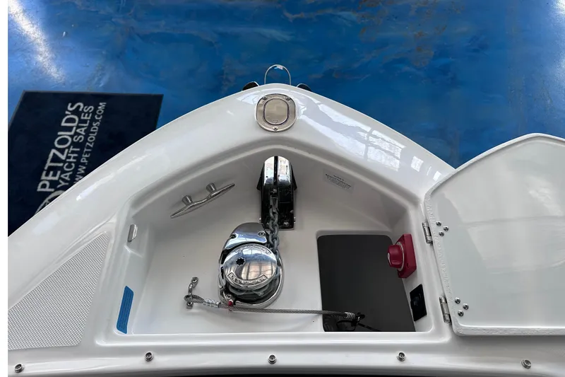 Slide: The Image of Bow of 2026 Regal LX6 boat with anchor compartment and winch. - 34