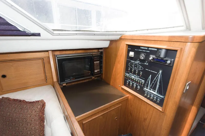 Slide: The Image of Interior of 1984 Jouet 1280 sailboat with control panel and microwave. - 26