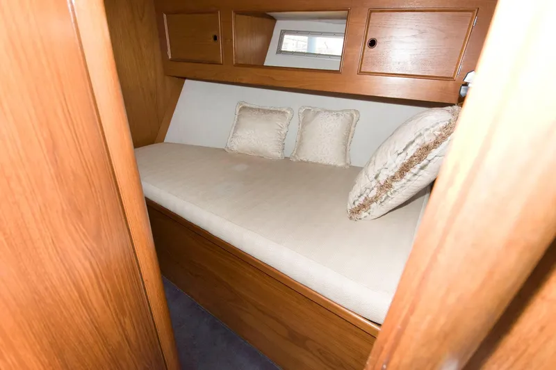 Slide: The Image of Cozy cabin bed in 1984 Jouet 1280 sailboat with wooden storage cabinets. - 29