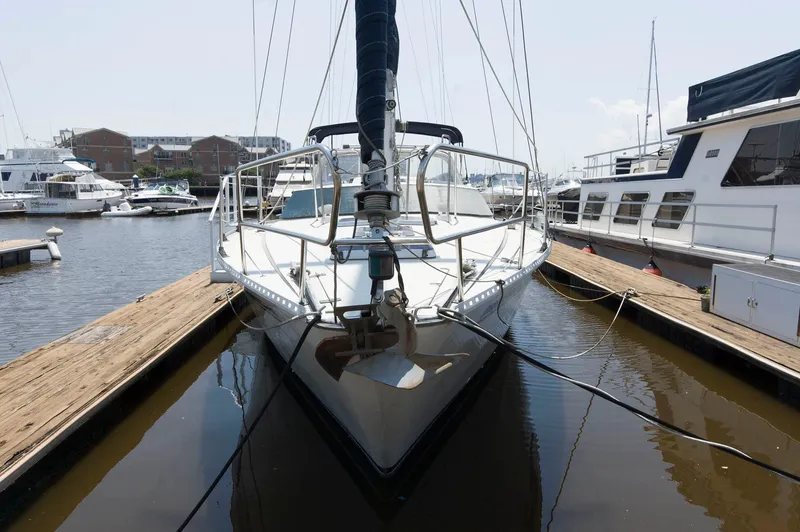 Slide: The Image of Jouet 1280 sailboat docked at marina, front view, 1984 model. - 4