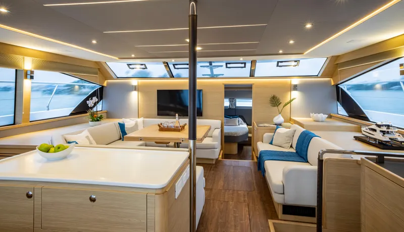 Slide: The Image of Luxurious interior of 2023 Aquila 54 Yacht with modern furnishings and panoramic windows. - 24