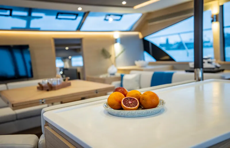 Slide: The Image of Luxurious interior of 2023 Aquila 54 Yacht with modern design and fresh fruit. - 32