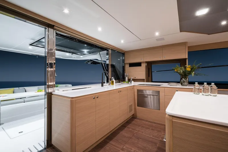 Slide: The Image of Modern kitchen interior on 2023 Aquila 54 Yacht with sleek design and ocean view. - 49