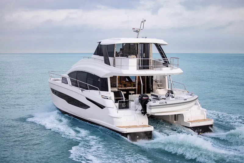 Slide: The Image of 2023 Aquila 54 Yacht cruising on open water. - 6