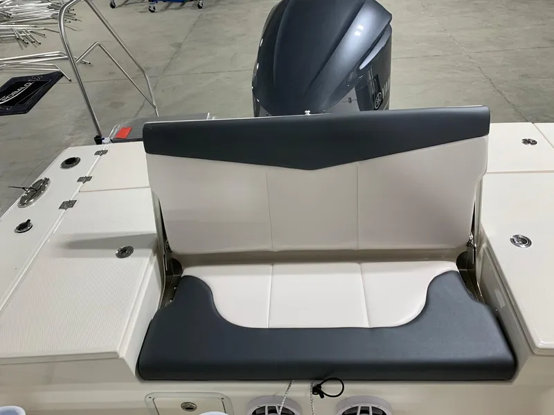 Slide: The Image of 2024 Robalo 246 Cayman boat rear seating and outboard motor. - 13
