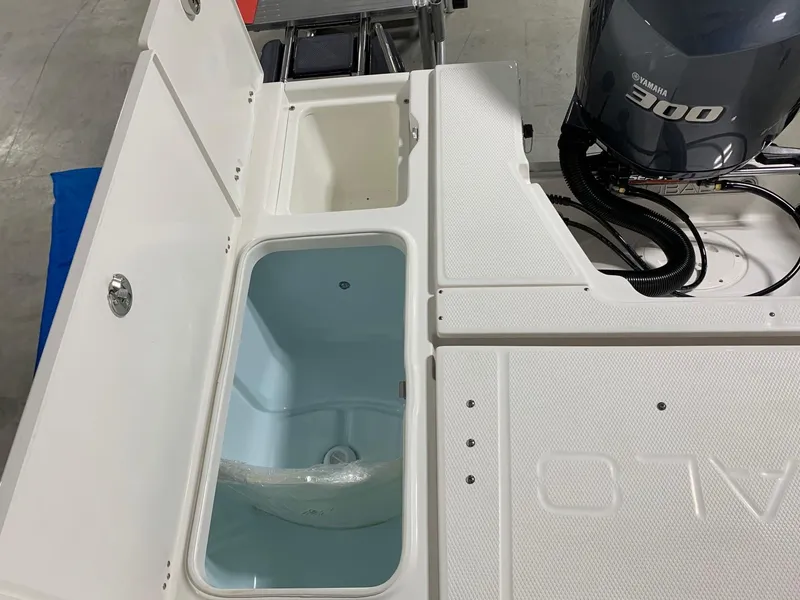 Slide: The Image of 2024 Robalo 246 Cayman boat with Yamaha 300 engine and livewell compartments. - 18