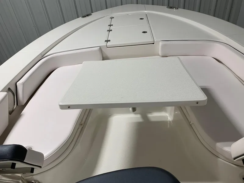 Slide: The Image of 2024 Robalo 246 Cayman boat with bow seating and table. - 22