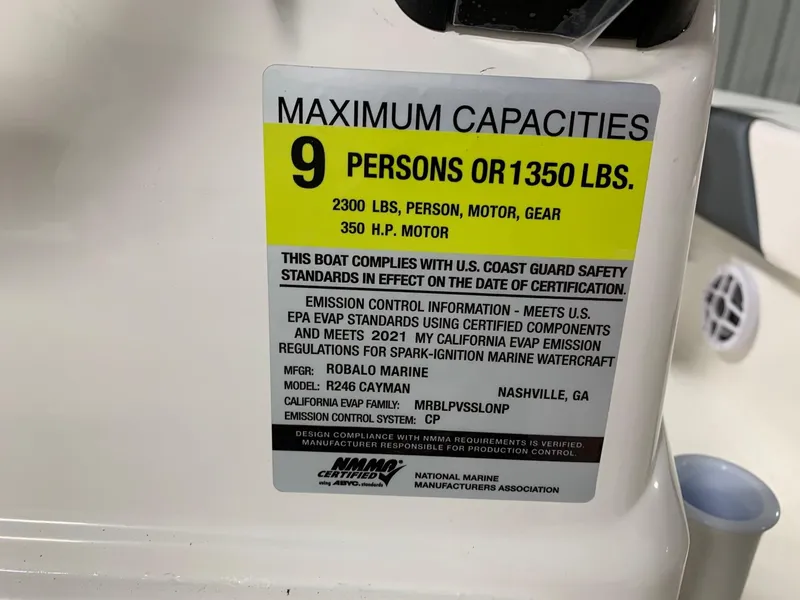 Slide: The Image of 2024 Robalo 246 Cayman boat capacity label, 9 persons or 1350 lbs, 350 HP motor. - 28