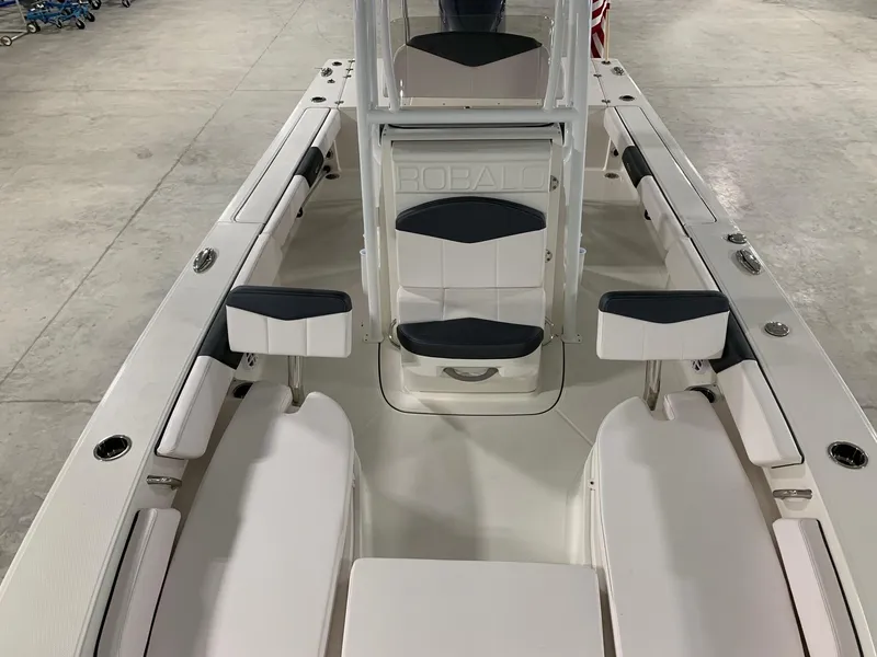 Slide: The Image of 2024 Robalo 246 Cayman boat interior with seating and console. - 3