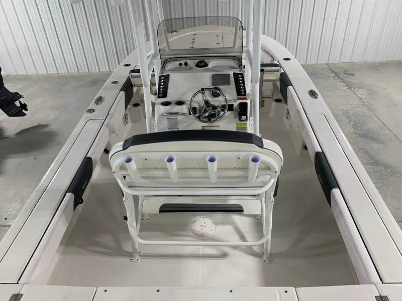 Slide: The Image of 2024 Robalo 246 Cayman boat interior with helm station and seating. - 4